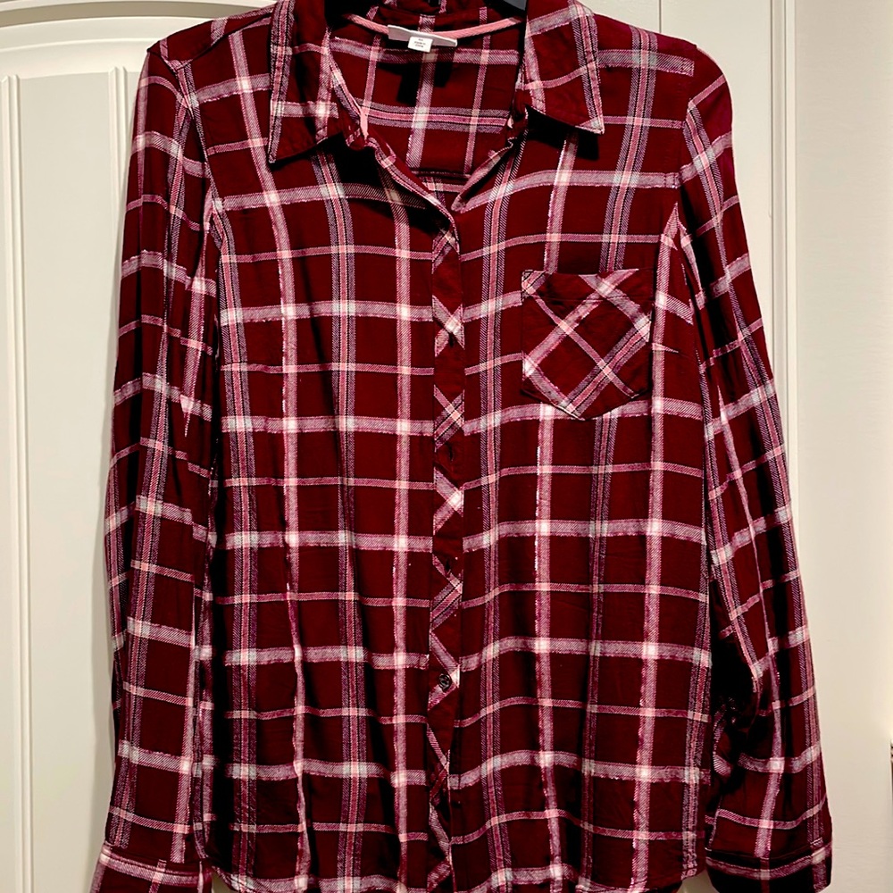 Burgundy, white, black, shimmery pink metallic threads, one pocket shirt.